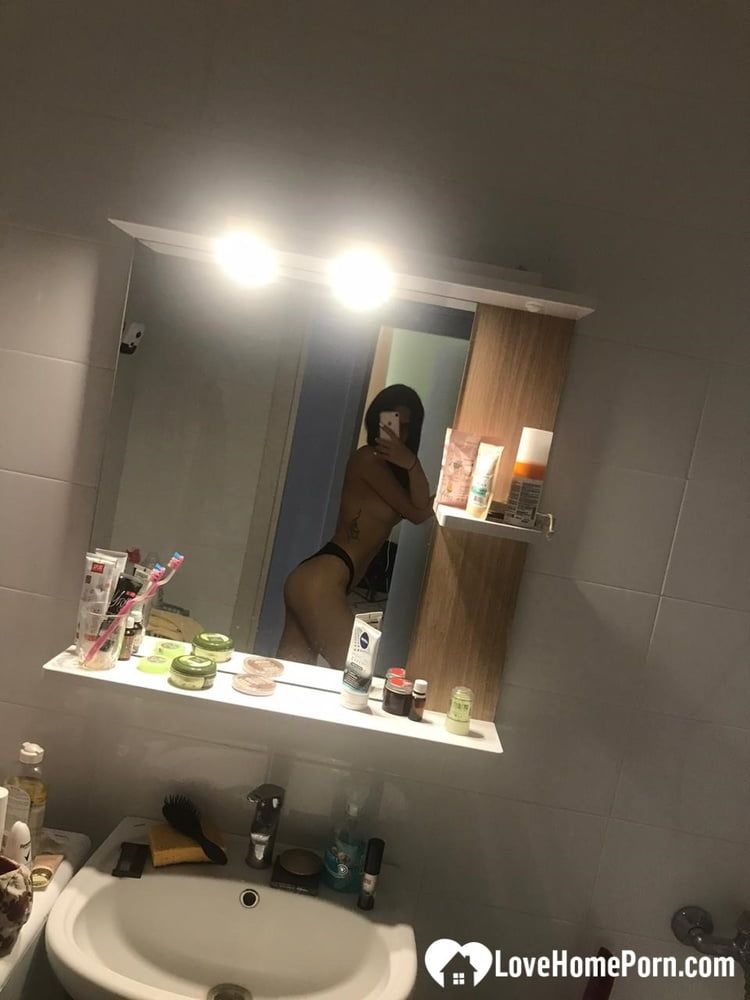 Hot schoolgirl reveals her tits in the mirror #6