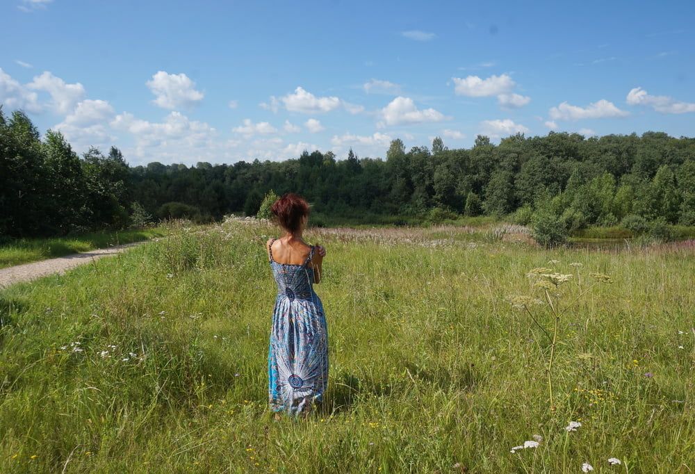 In blue dress in field #25