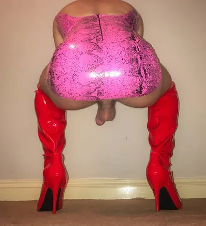 pink vinyl pvc snakeskin dress with red latex boots         