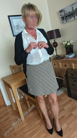 ready for work in skirt blouse pantyhose and heels         