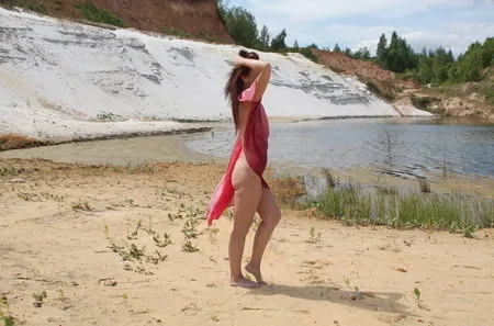 red shawl on white sand         