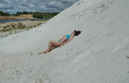 on white sand in turquos bikini         