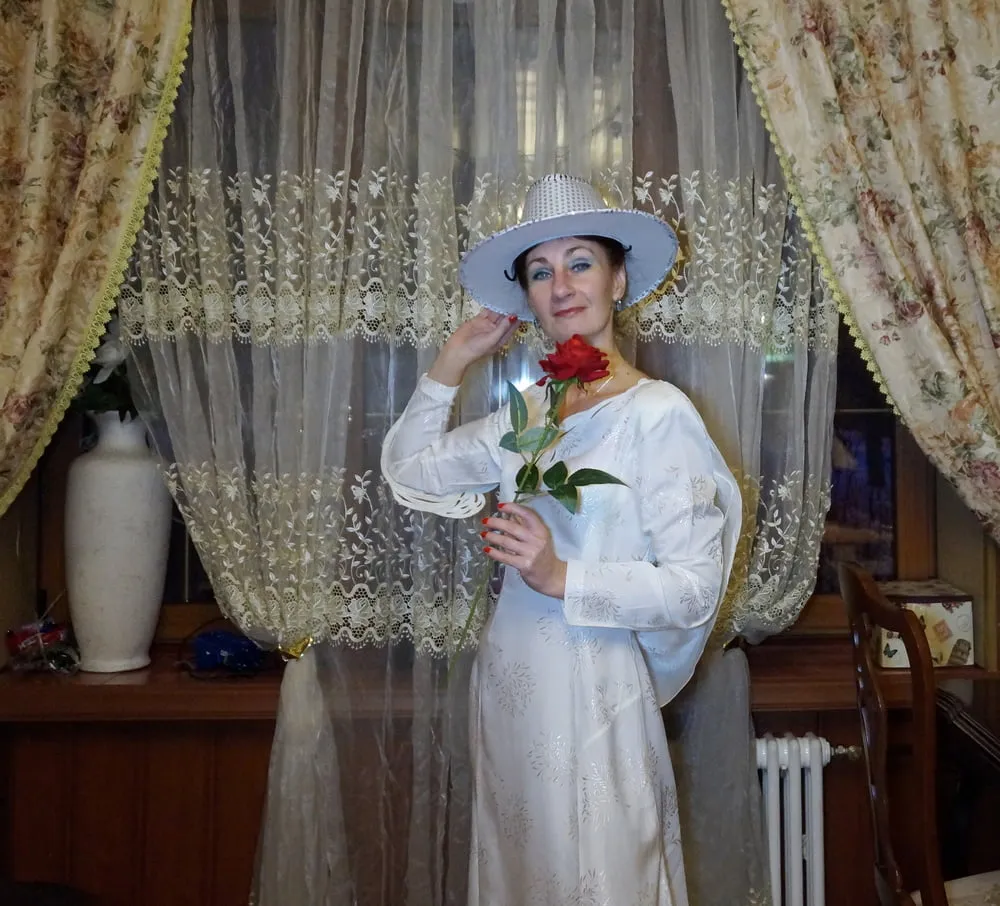 In Wedding Dress and White Hat