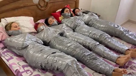   mummified girls barefoot in duct tape bondage         