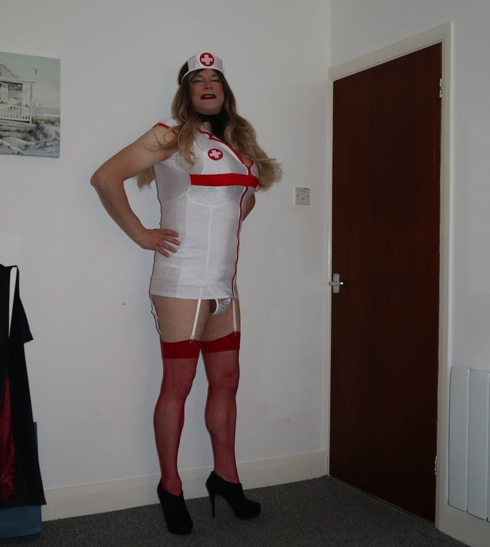 slutty looking nurse in red fishnet stockings