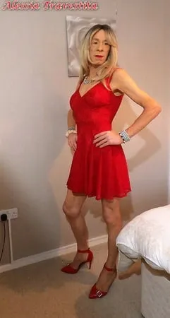    alessia travestita in flirty red dress         