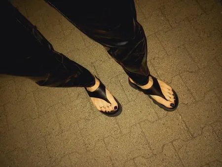 platform flip flops and latex pants         