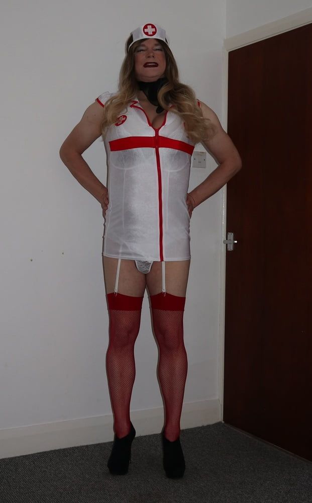 slutty looking nurse in red fishnet stockings #6
