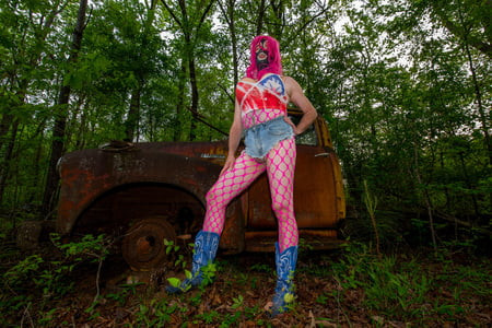 Giant fake tits crossdresser in Daisy Dukes and halter
