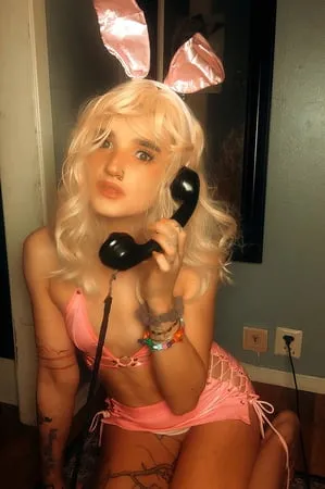 pink bunny talking on the phone while showing off pussy         