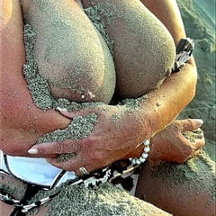 hotwife with giant BIG natural TITS covered with lake sand