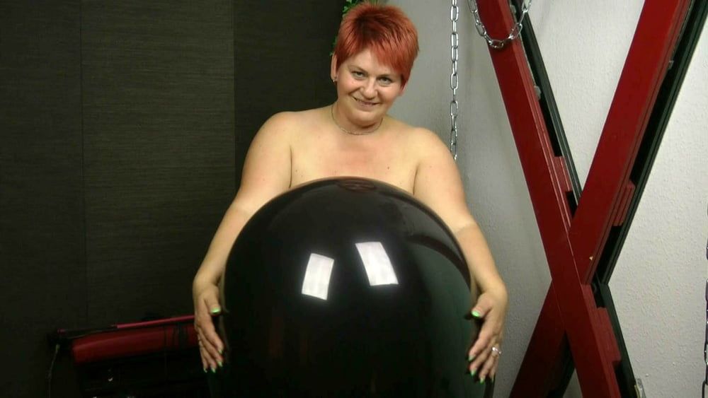 Naked with big black balloon