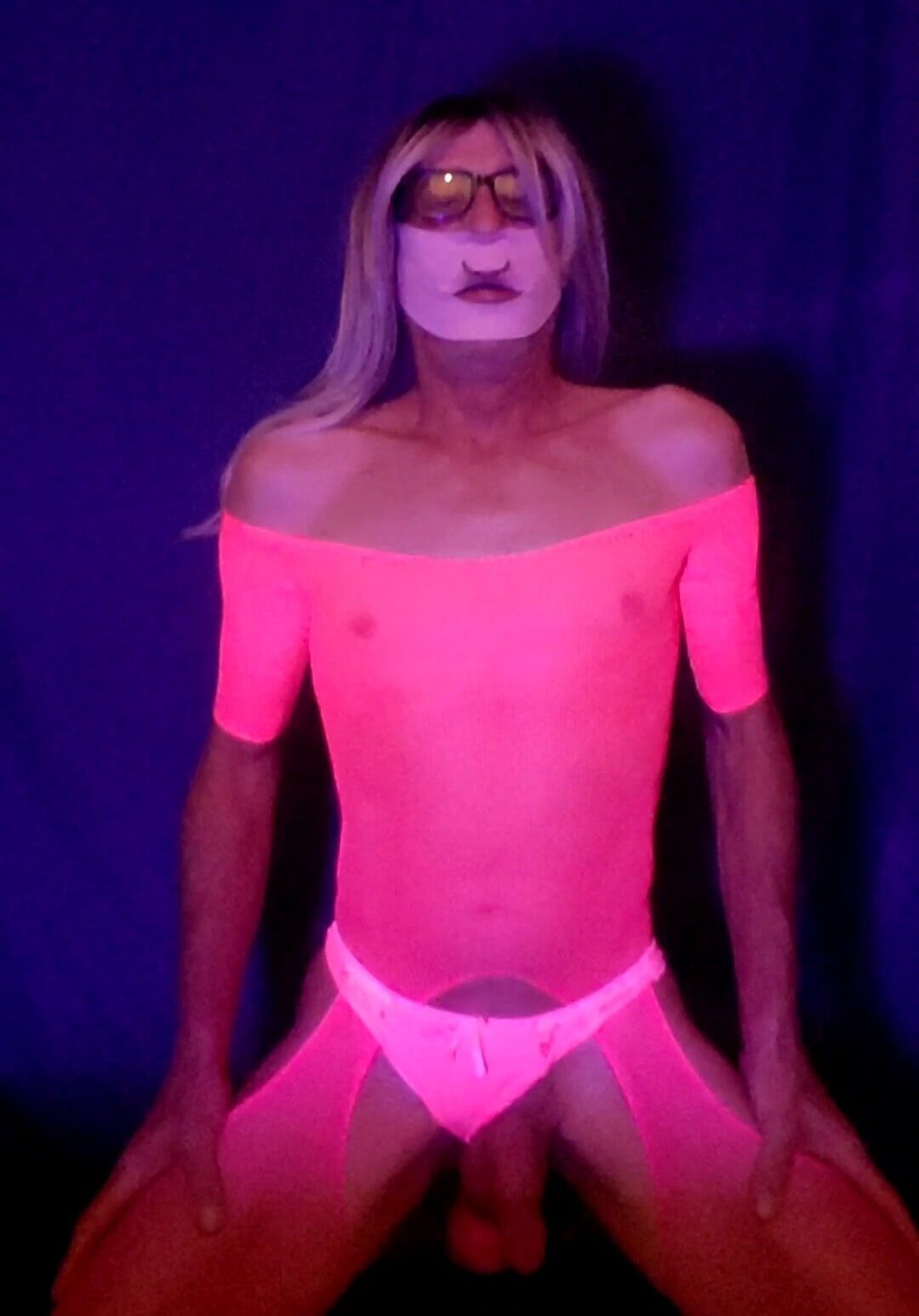 Pink bodystocking and dildo in black light #9