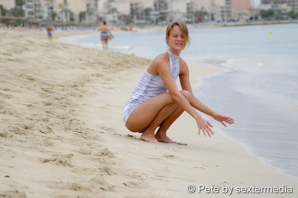 German amateur Petty shows naked pussy on the beach #21