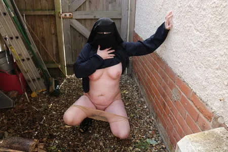 burqa outdoors flashing in the rain         