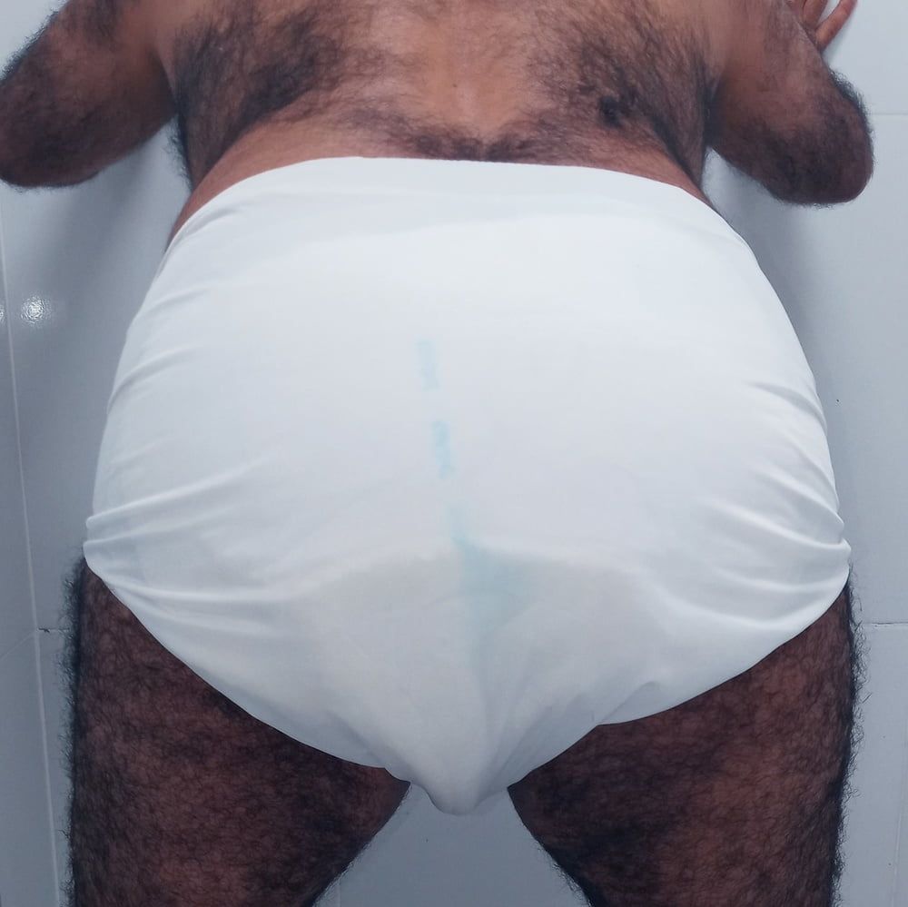 SHOWING WHITE DIAPER IN WORK BATHROOM. #14