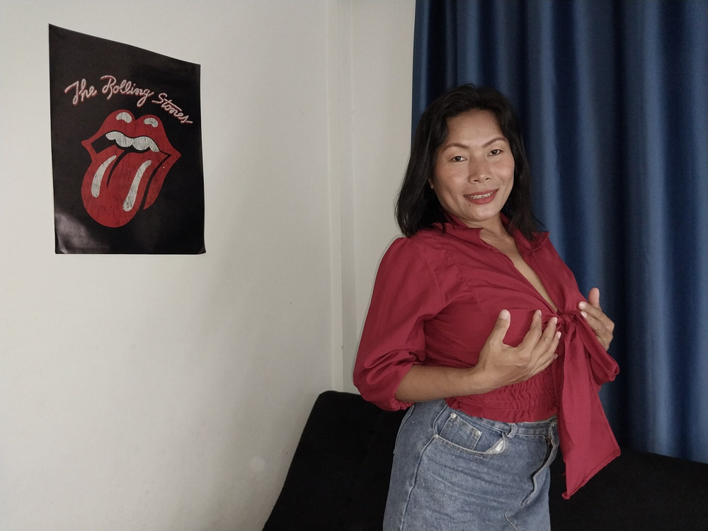 Thaiger on the Sofa in a Mini Skirt and a Red Top #10