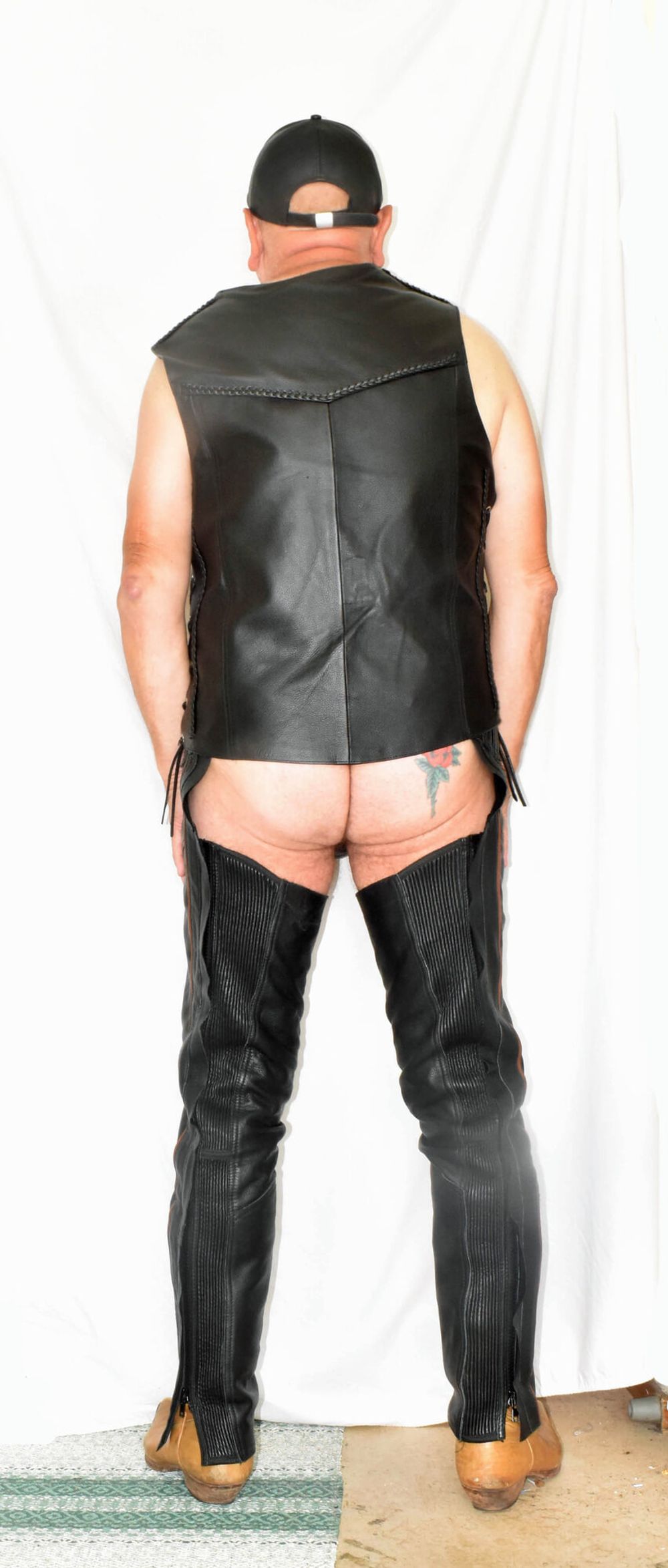 DRESSED IN A TIGHT SEXY LEATHER CHAPS AND JACKET VEST.. #11