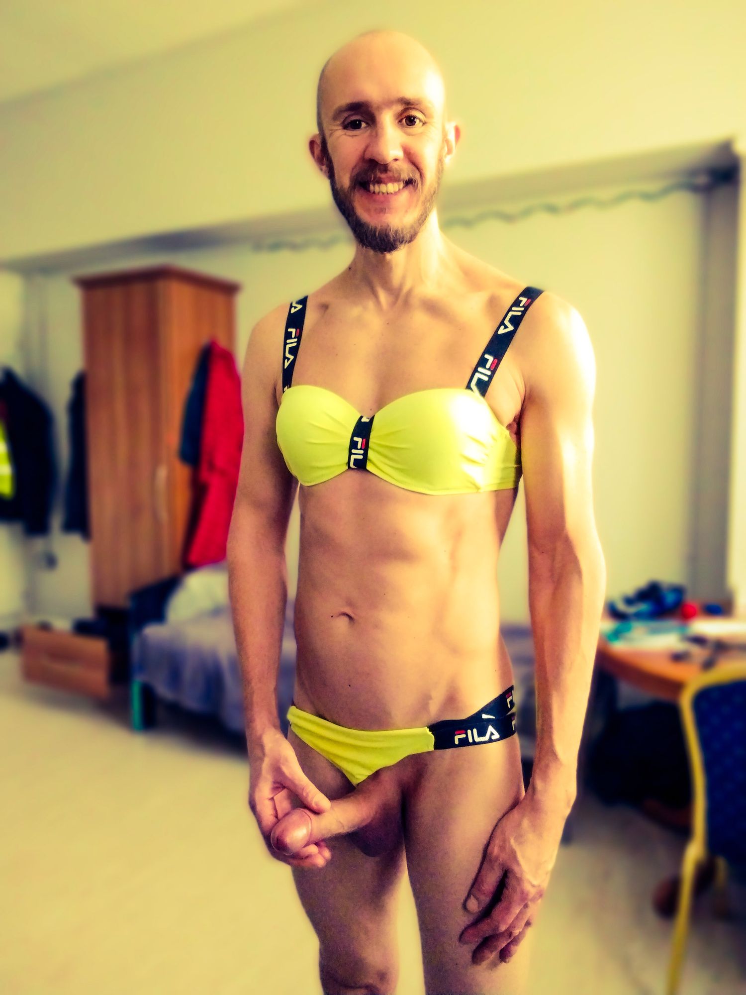 Bearded athletic man posing in yellow swimsuit  #14