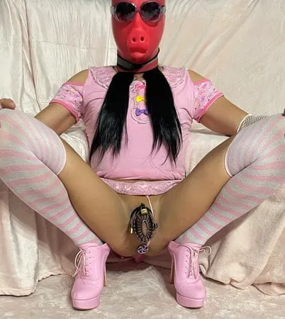 sissy wearing a pink dress heels and chastity cage pt           