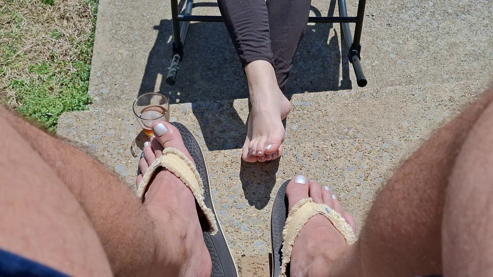 Relaxing outside showing our pedicured and painted toes #26