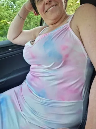 busty milf showing her huge tits in car         