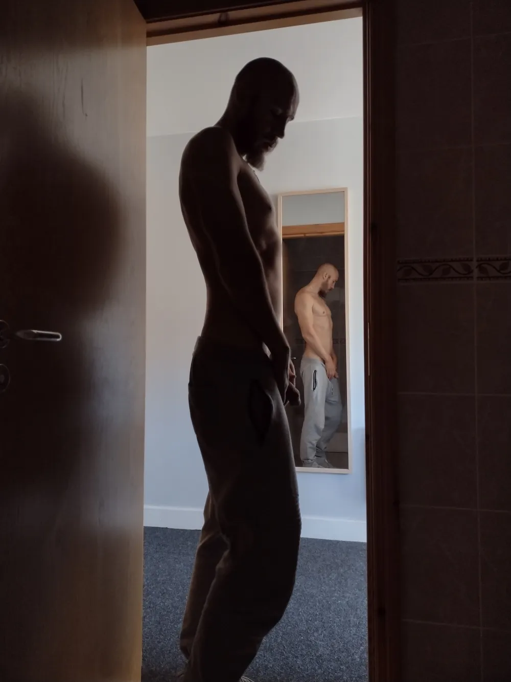 Posing nude in doorway #5