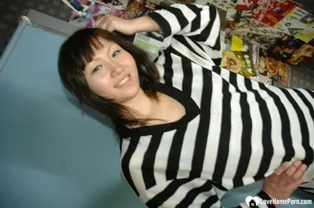 hot asian strips pantyhose and does sexy poses         