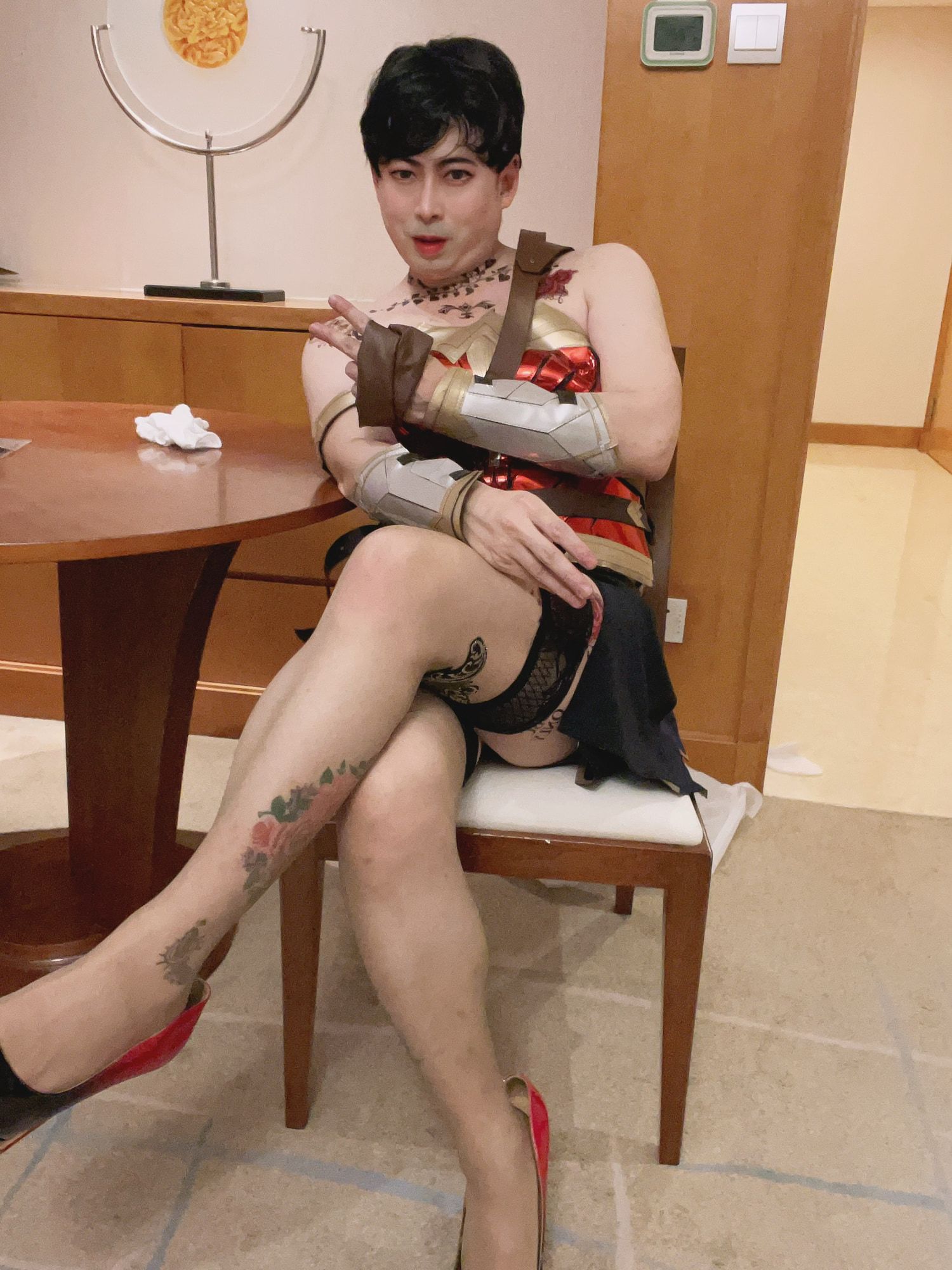 Asian sissy slut in wonder woman custome with tattoo