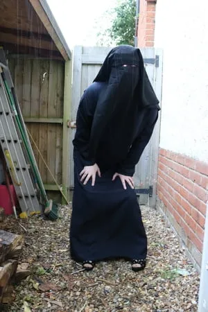 burqa outdoors flashing in the rain         