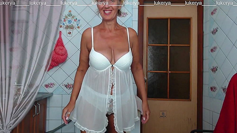 Lukerya in white transparent linen in the kitchen #2
