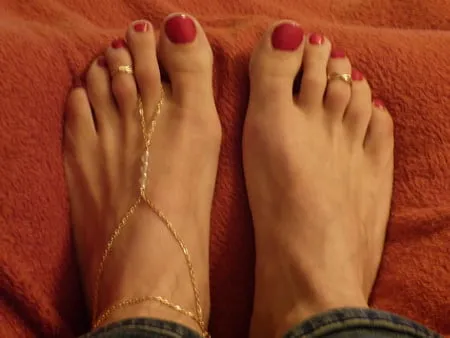 my feet in red polish jewelry and heels         