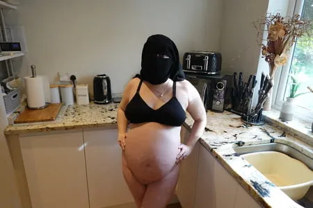 pregnant wife in muslim niqab and nursing bra         