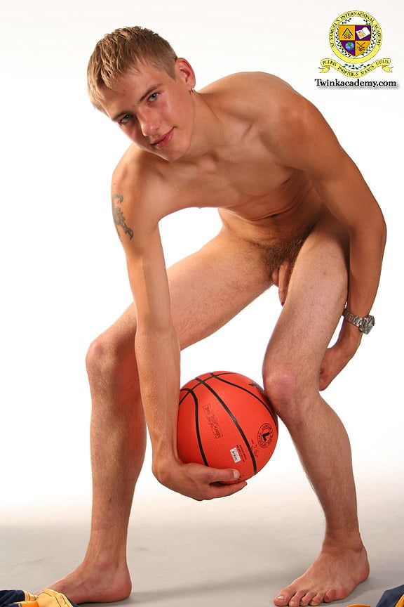 Blond teenage Latvian hunk poses in his basketball uniform #10