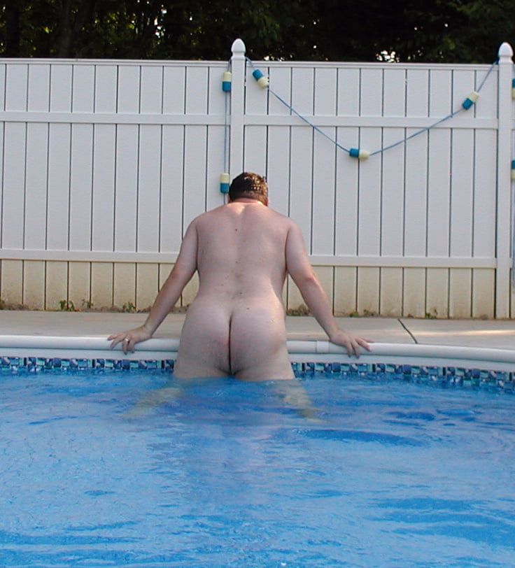 Chubby Guy Suns His Small Shaved Cock By The Pool