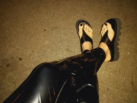 platform flip flops and latex pants         