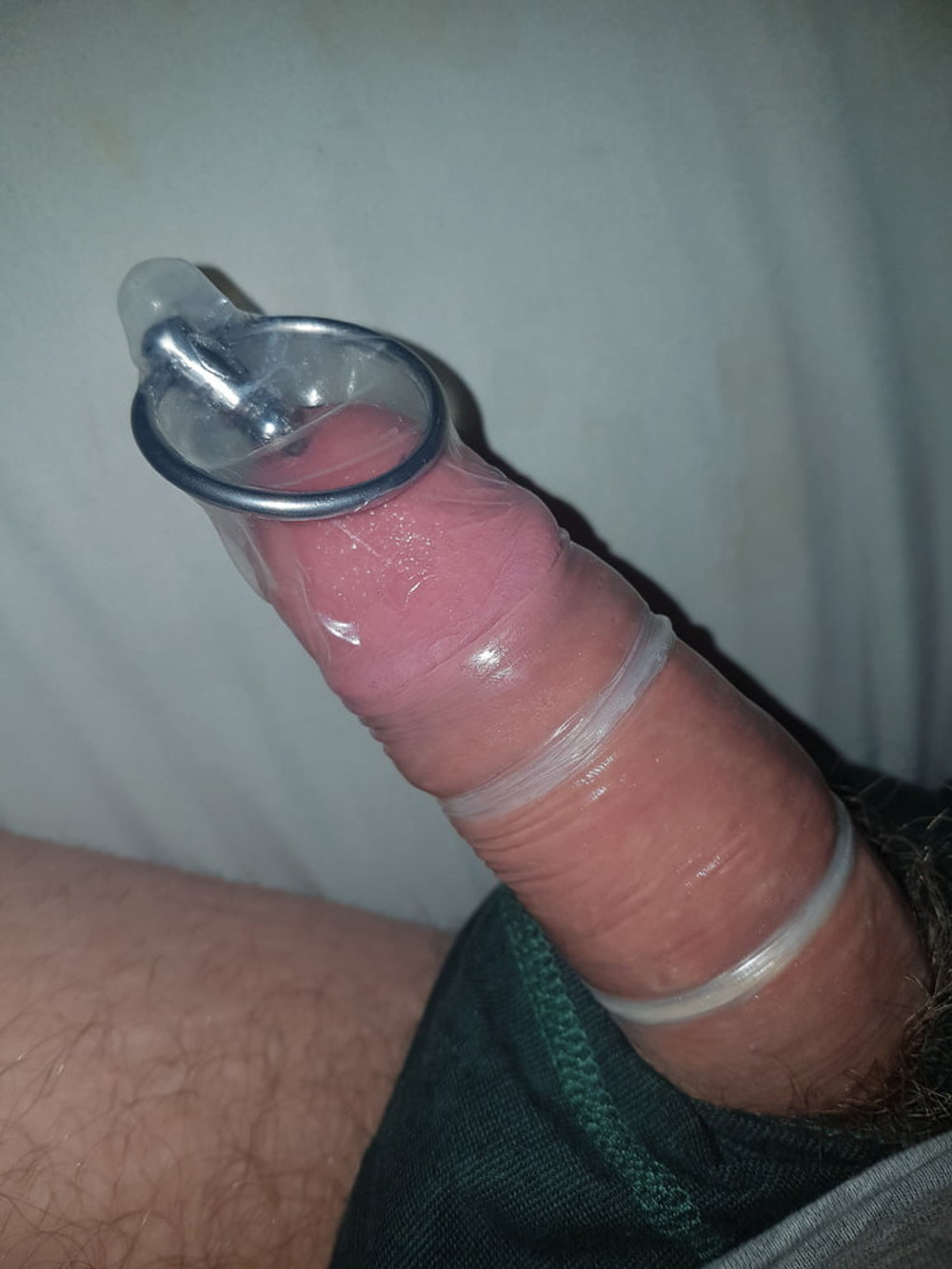 Deep sounding, urethral sounding inside condom covered cock