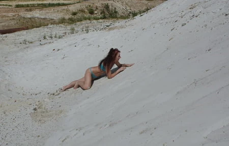 on white sand in turquos bikini         