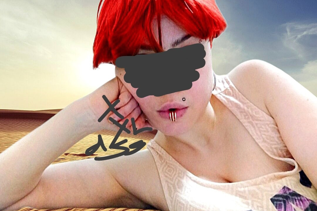 red short-haired, oriental, pierced, white Muslim woman