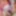 Lying back in red open crotch fishnets with dildo in rubbing