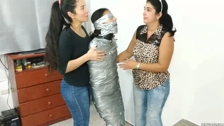 heavily duct tape mummified by crazy bondage women         