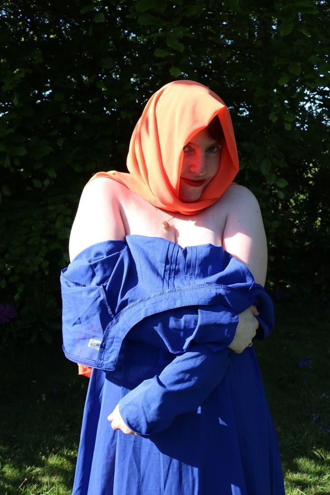 hijab and abaya flashing outdoors #35