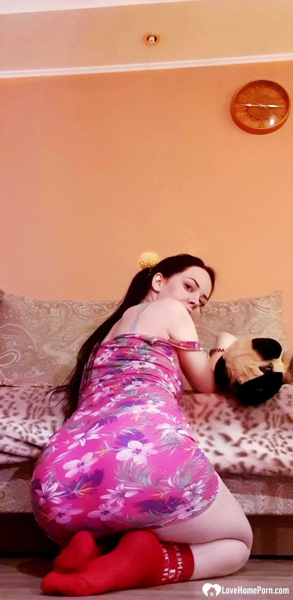 Brunette with pigtails poses in knee socks