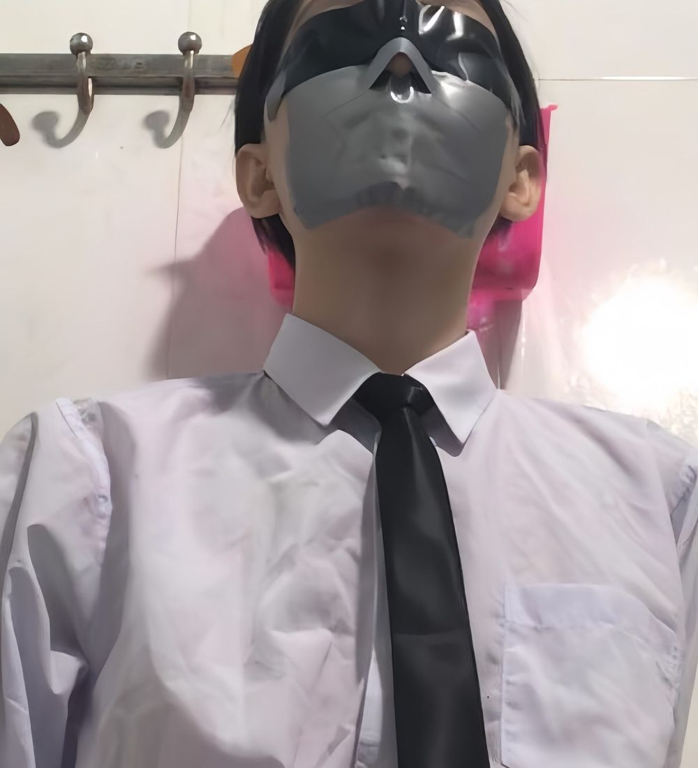 Wearing a white shirt and shiny black tie, gagged with duct  #20