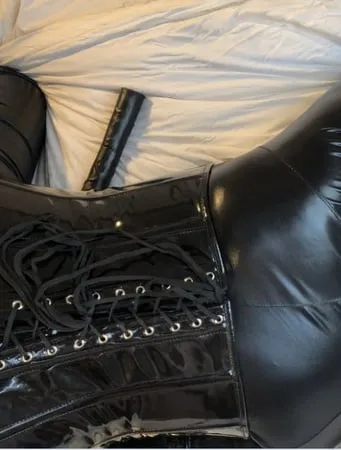 black catsuit boots corset and vibrator         