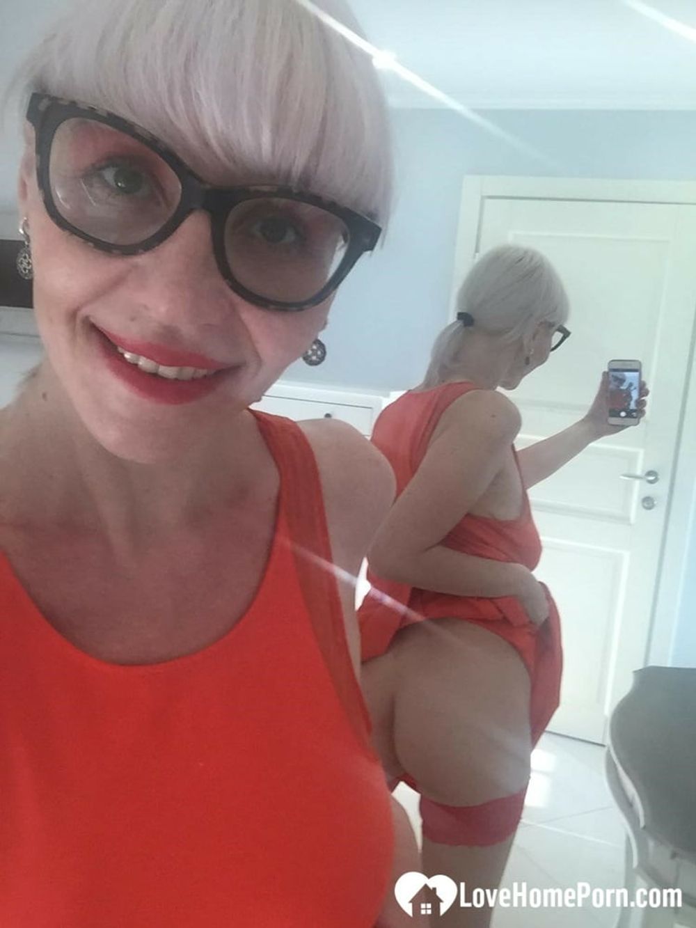 Blonde MILF with glasses teasing with nudes #7