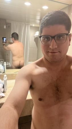 Naked in front of a mirror in the bathroom