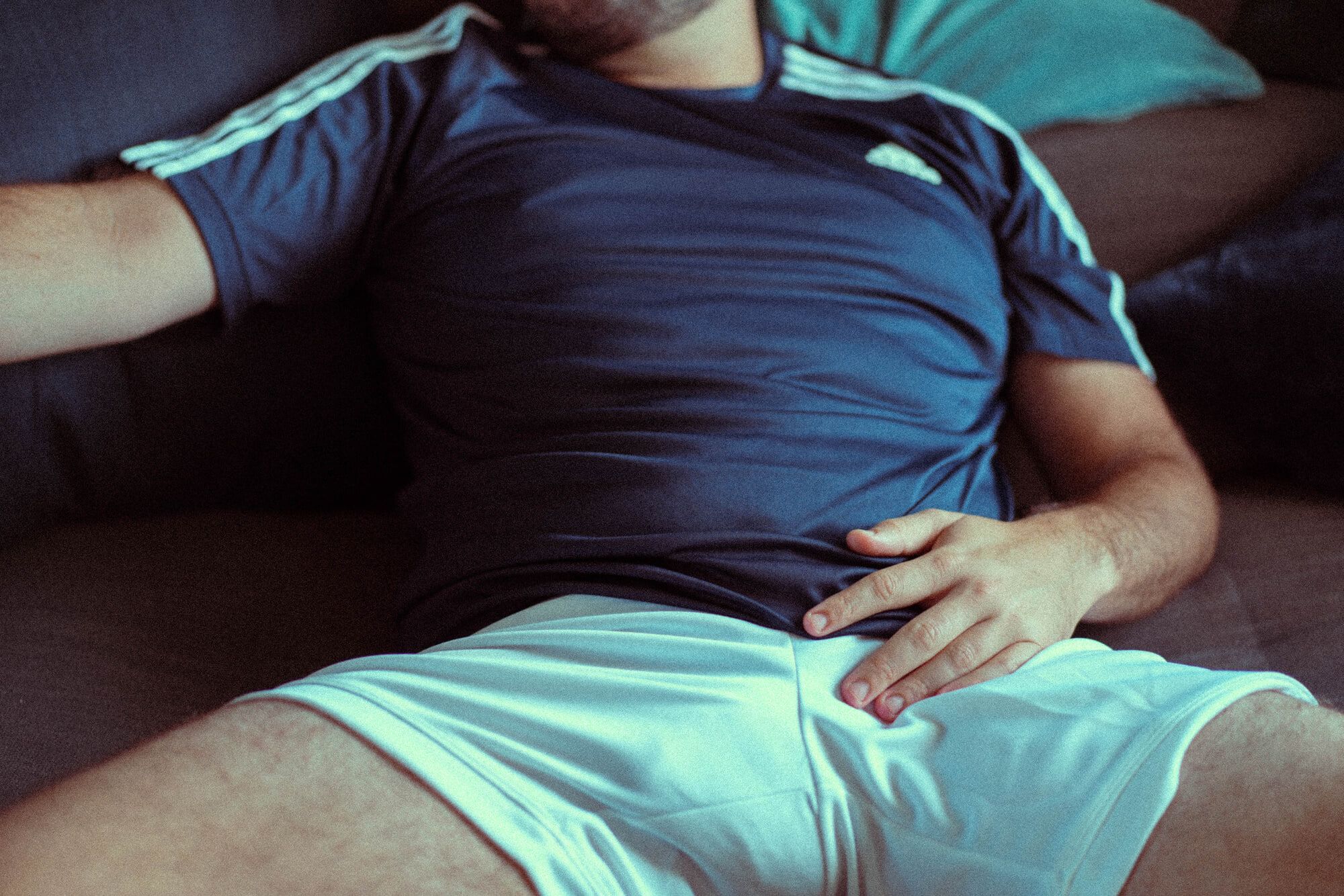 Sportswear bulge on the sofa