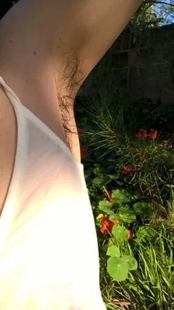 my beautiful hairy wife in wet t shirt in the garden         