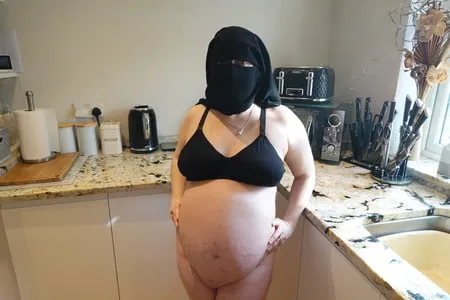 pregnant wife in muslim niqab and nursing bra         